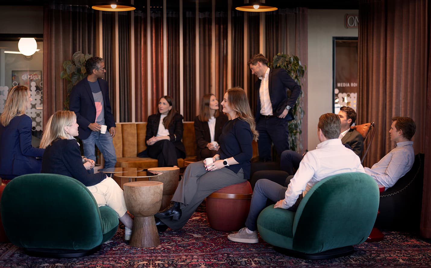 Team gathering in the lounge.